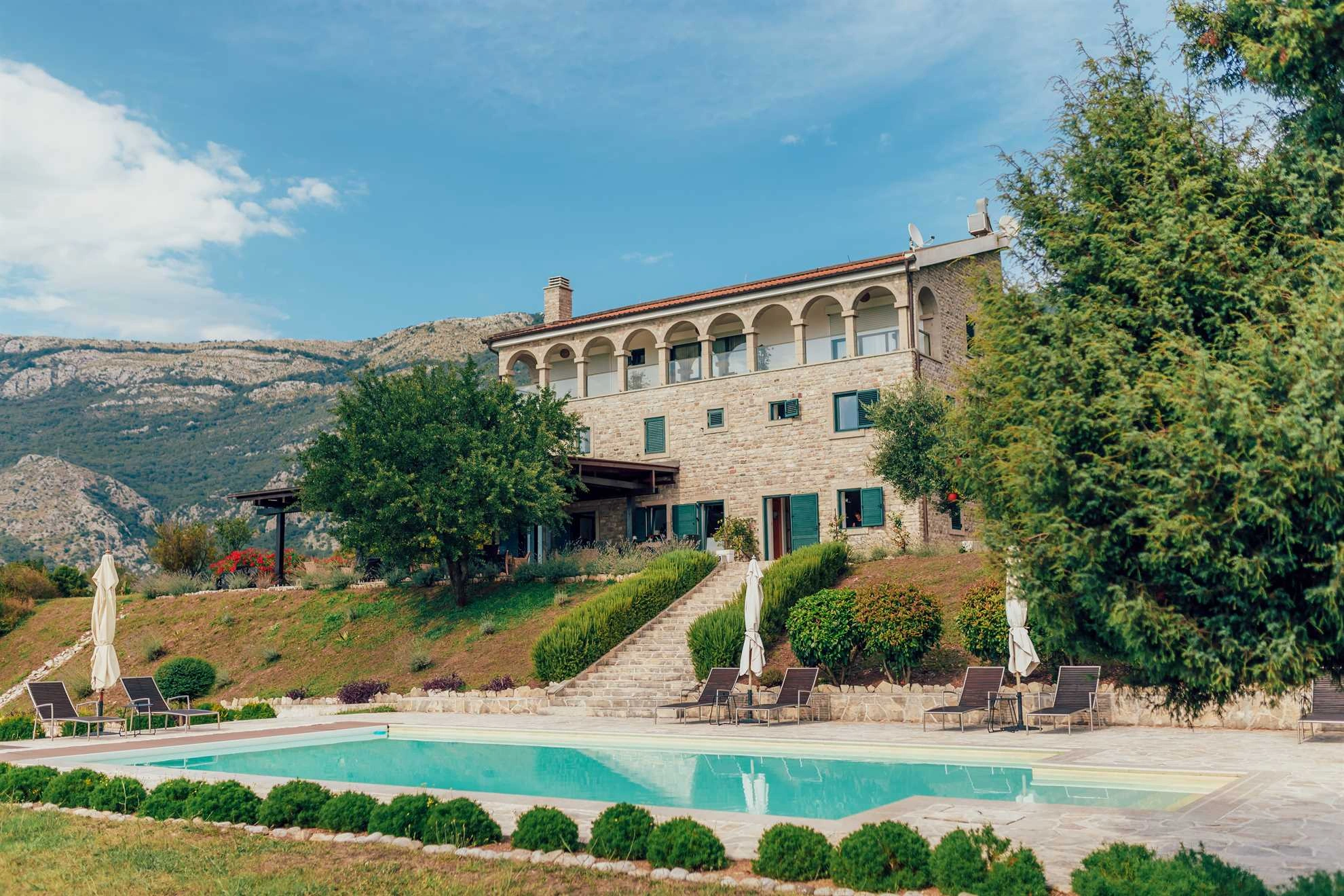 Gorgeous Exterior of a Beautiful Villa in Montenegro with Lush Surroundings